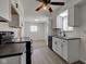 Kitchen view highlighting ample cabinet space, stainless steel sink, and modern appliances for cooking and preparation at 4139 N Grand Ave, Indianapolis, IN 46226