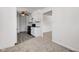 Bright kitchen featuring white cabinetry, a ceiling fan, and modern appliances with ample counter space at 4139 N Grand Ave, Indianapolis, IN 46226