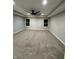 An empty bedroom features neutral colors, a ceiling fan, and carpeting at 4187 Risen Star Way, Bargersville, IN 46106