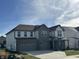 Beautiful two-story home with a two-car garage and lovely gray and white color scheme at 4187 Risen Star Way, Bargersville, IN 46106