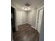 Hallway with hardwood floors and access to a bathroom and another room at 4187 Risen Star Way, Bargersville, IN 46106