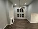 Bright living room features a fireplace, modern ceiling fan, and a large window providing natural light at 4187 Risen Star Way, Bargersville, IN 46106