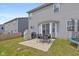 Patio area with a grill and seating, situated in a well-maintained backyard at 4345 Indigo Walk Ln, Indianapolis, IN 46239