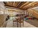 Unfinished basement area with exposed ceiling, table, seating, and a play area at 4345 Indigo Walk Ln, Indianapolis, IN 46239