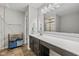 Bright bathroom with double vanity, well-lit mirror, and tiled floors at 4345 Indigo Walk Ln, Indianapolis, IN 46239