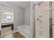 Bright bathroom with separate shower and soaking tub; doorway view to bedroom at 4345 Indigo Walk Ln, Indianapolis, IN 46239