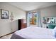 Bright bedroom featuring a large window and vanity area at 4524 Moss Creek Ter, Indianapolis, IN 46237