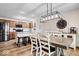 Open concept with dining area near kitchen showcasing stainless steel appliances and kitchen island at 4524 Moss Creek Ter, Indianapolis, IN 46237
