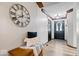 Stylish hallway with wood floors, a decorative bench, and a view of the front door at 4524 Moss Creek Ter, Indianapolis, IN 46237