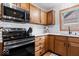Well-equipped kitchen featuring stainless steel appliances, ample cabinet space, and modern fixtures at 4524 Moss Creek Ter, Indianapolis, IN 46237