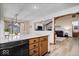 Open kitchen with granite countertops flows into a dining area, creating an ideal space for entertaining at 4524 Moss Creek Ter, Indianapolis, IN 46237