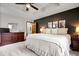 Comfortable main bedroom featuring a plush bed, dark accent wall, and ample closet space at 4524 Moss Creek Ter, Indianapolis, IN 46237