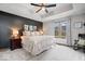 Cozy main bedroom with soft carpet, tray ceiling, and a comfortable bed at 4524 Moss Creek Ter, Indianapolis, IN 46237