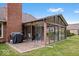 Enclosed sunroom with a patio, grill, and view of the fenced backyard at 4524 Moss Creek Ter, Indianapolis, IN 46237