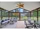 Beautiful sunroom featuring brick floors, stylish furniture, and views of the backyard at 4524 Moss Creek Ter, Indianapolis, IN 46237