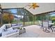 Bright sunroom with brick floors and a comfortable seating area for relaxing and entertaining at 4524 Moss Creek Ter, Indianapolis, IN 46237