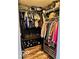 Organized walk-in closet with built-in shelving and ample storage space for clothes and shoes at 520 Gatewood Dr, Greenwood, IN 46143