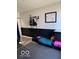 Versatile flex room with black wainscoting, padded floor, and comfortable bench seating at 520 Gatewood Dr, Greenwood, IN 46143