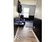Hallway leading into a flex room with black wainscoting and natural light from a bright window at 520 Gatewood Dr, Greenwood, IN 46143
