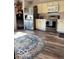 Modern kitchen featuring stainless steel appliances, ample cabinet space, and stylish flooring for a contemporary feel at 520 Gatewood Dr, Greenwood, IN 46143