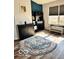 Cozy living room showcasing stylish flooring, a modern rug, and ample natural light creating a welcoming and bright space at 520 Gatewood Dr, Greenwood, IN 46143