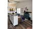 Bright living room with vaulted ceilings, hardwood floors, and open access to the kitchen at 520 Gatewood Dr, Greenwood, IN 46143
