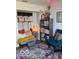 Cozy sitting area nook featuring comfortable seating, built in shelving and a round decorative rug at 520 Gatewood Dr, Greenwood, IN 46143