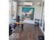 Cozy sunroom features a large painting and exercise equipment for a complete workout experience at 520 Gatewood Dr, Greenwood, IN 46143