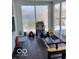 Bright sunroom features sliding glass doors and ample space for exercise equipment and relaxation at 520 Gatewood Dr, Greenwood, IN 46143