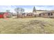 The wooden deck overlooks the spacious, tree-lined backyard and is perfect for outdoor relaxation and entertainment at 5465 Leone Dr, Indianapolis, IN 46226