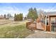 The wooden deck overlooks the spacious, tree-lined backyard and is perfect for outdoor relaxation and entertainment at 5465 Leone Dr, Indianapolis, IN 46226