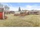 The wooden deck overlooks the spacious, tree-lined backyard and is perfect for outdoor relaxation and entertainment at 5465 Leone Dr, Indianapolis, IN 46226