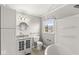 This bathroom features a vanity sink, commode and bathtub at 5465 Leone Dr, Indianapolis, IN 46226