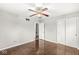 This bedroom features hardwood floors, closet, and ceiling fan at 5465 Leone Dr, Indianapolis, IN 46226
