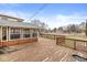 Spacious wooden deck perfect for outdoor entertaining, with views of the lush backyard and nearby neighborhood at 5465 Leone Dr, Indianapolis, IN 46226