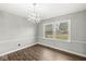 Dining room with wood-look floors and chandelier at 5465 Leone Dr, Indianapolis, IN 46226