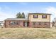 Charming two-story home featuring brick and siding with red shutters and a well-maintained front yard at 5465 Leone Dr, Indianapolis, IN 46226