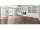 The living room includes a decorative fireplace, updated flooring, and open shelving with updated flooring at 5465 Leone Dr, Indianapolis, IN 46226
