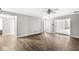 An open-concept living room features updated flooring and fresh, neutral paint throughout the space at 5465 Leone Dr, Indianapolis, IN 46226