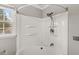 This is a bathtub-shower combination unit with shelves and a shower curtain rod at 5465 Leone Dr, Indianapolis, IN 46226