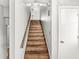 Staircase with wooden steps and white walls for a clean, modern look at 5465 Leone Dr, Indianapolis, IN 46226