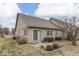 A view of the backyard and patio with mature landscaping and trees at 613 Brook Dr, Greenwood, IN 46143