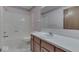A neutral bathroom features a shower/tub and a vanity with storage at 613 Brook Dr, Greenwood, IN 46143