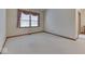 An ample bedroom with large windows, neutral carpeting, and a peaceful atmosphere at 613 Brook Dr, Greenwood, IN 46143