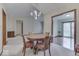 Bright dining room with a round table, striped chairs, and an open floor plan at 613 Brook Dr, Greenwood, IN 46143