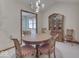 Traditional dining room featuring a round table, wooden chairs, and a china cabinet at 613 Brook Dr, Greenwood, IN 46143