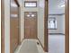 Inviting entryway with tile flooring, a wooden door, and an open view to the living area at 613 Brook Dr, Greenwood, IN 46143