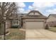 Charming single-Gathering home with a two-car garage, brick facade, and well-maintained lawn at 613 Brook Dr, Greenwood, IN 46143
