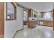 Open kitchen with wooden cabinets, modern appliances, and a view into the dining area at 613 Brook Dr, Greenwood, IN 46143