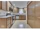 Bright kitchen featuring wooden cabinets, modern appliances, and hardwood flooring at 613 Brook Dr, Greenwood, IN 46143
